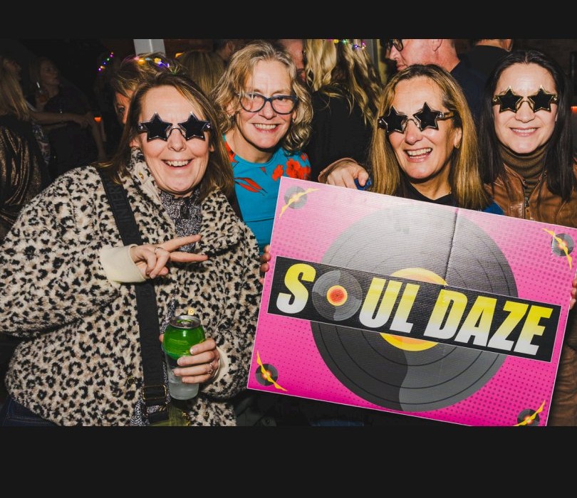 Group with Soul Daze sign